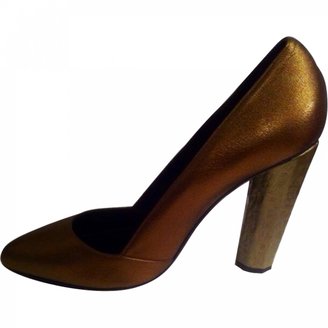 Aperlaï Gold Leather Heels