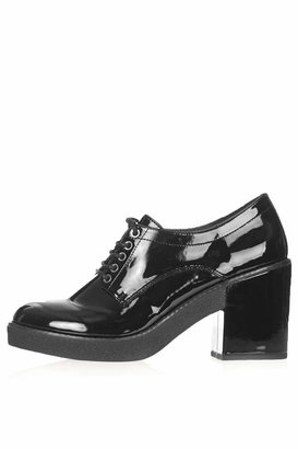 Topshop Black patent chunky lace up mid shoes. heel height approximately 3.5". 100% polyurethane. specialist clean only.
