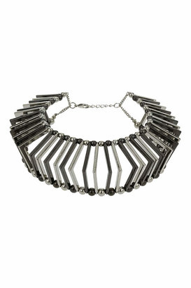 Topshop Freedom at 100% metal. Gunmetal and silver-look cage effect collar made from triangular shaped sections, unfastened length 14 inches with 3 inch extension chain.
