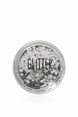 Topshop Building up layers of glitter onto desired areas for a dramatic foil-like finish. facial glue is not included. Lightweight, loose glitter for use on the face and body - perfect for festivals and parties. apply