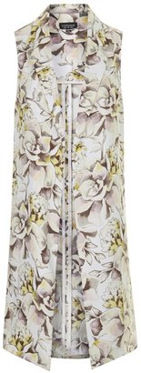 Topshop Light throw-on sleeveless coat in all-over floral print with open side seams. 100% polyester. dry clean only.