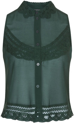 Topshop Sleeveless button through shirt with crochet detailing on the collar. 100% polyester. machine washable.